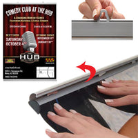 By hand, simply snap open both snap bar rails, top and bottom, slide graphic or poster in, and snap close 