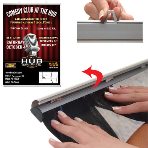 By hand, simply snap open both snap bar rails, top and bottom, slide graphic or poster in, and snap close 