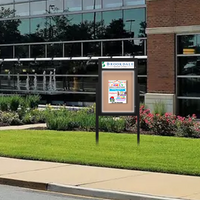 Freestanding EXTREME WeatherPLUS™ Radius Edge Outdoor Enclosed Poster Cases with Personalized Message Header + LED Lights | Shown In Black Frame Finish